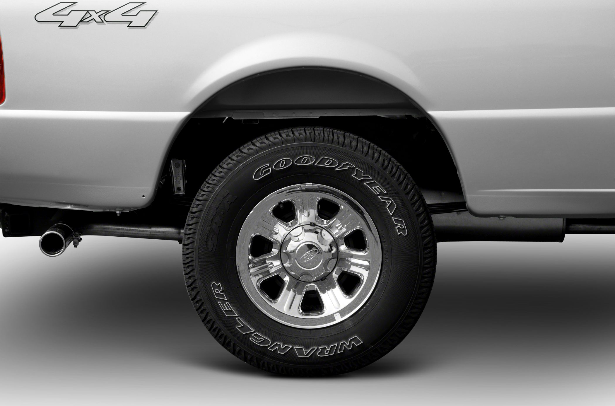 4x4 rear wheel with Goodyear Wrangler tire and exhaust pipe