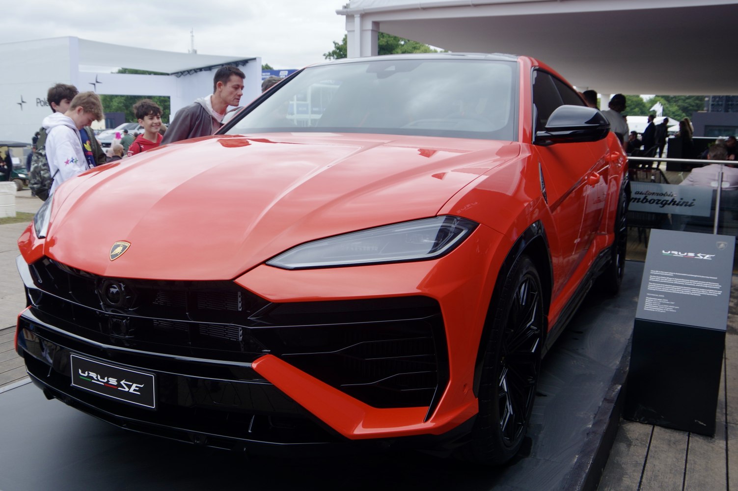 Aggressive front grille and sleek headlights of a red SUV