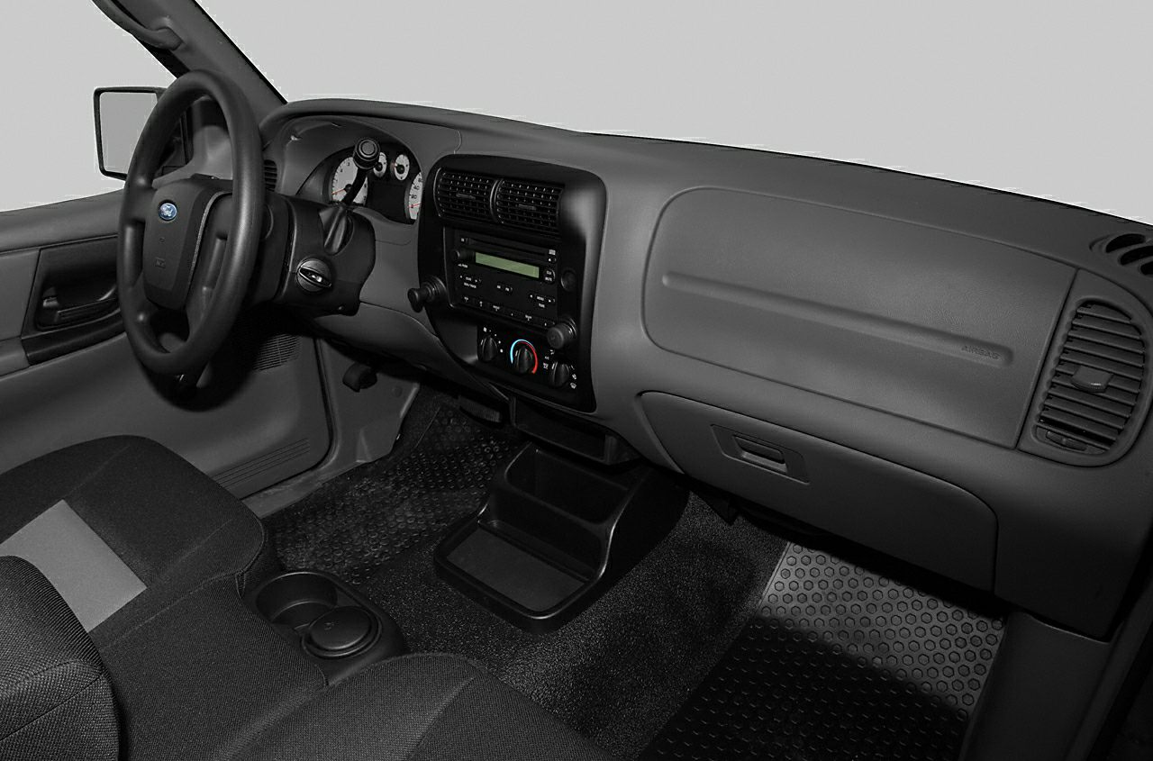 Dashboard, steering wheel, and control panel of a pickup truck interior