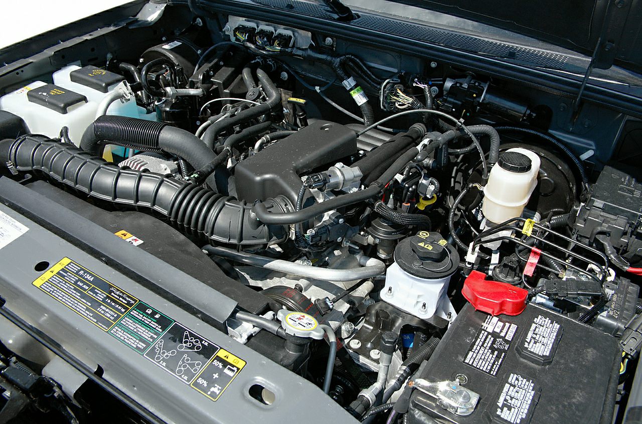 Detailed view of engine components and layout in open hood.