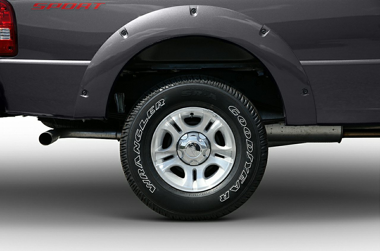 Rear wheel, Goodyear Wrangler tire, and fender flare with SPORT decal