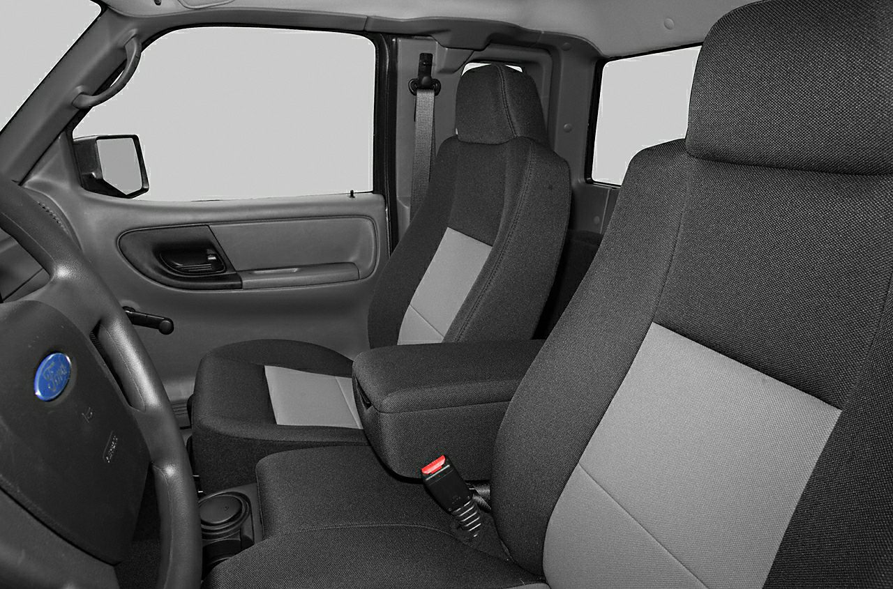 Fabric front seats and door panel with steering wheel in pickup interior