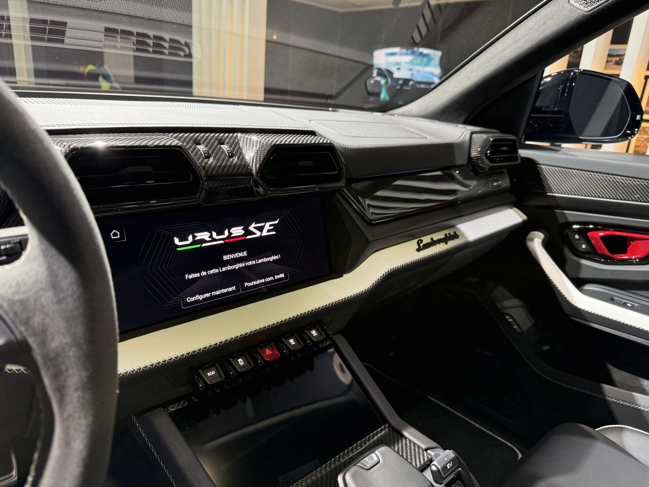 Carbon fiber dashboard and modern infotainment display with luxury interior details