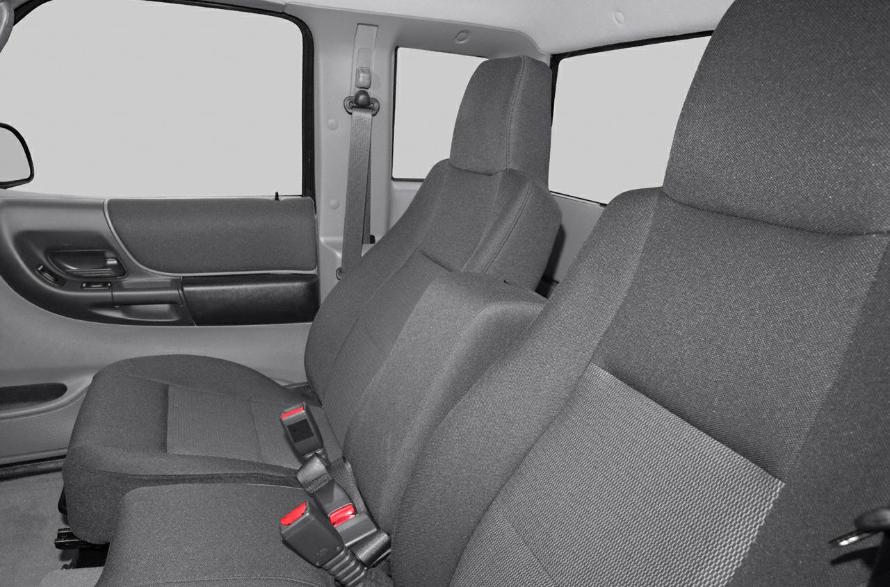 Front seats and door panel with seat belts and cloth upholstery