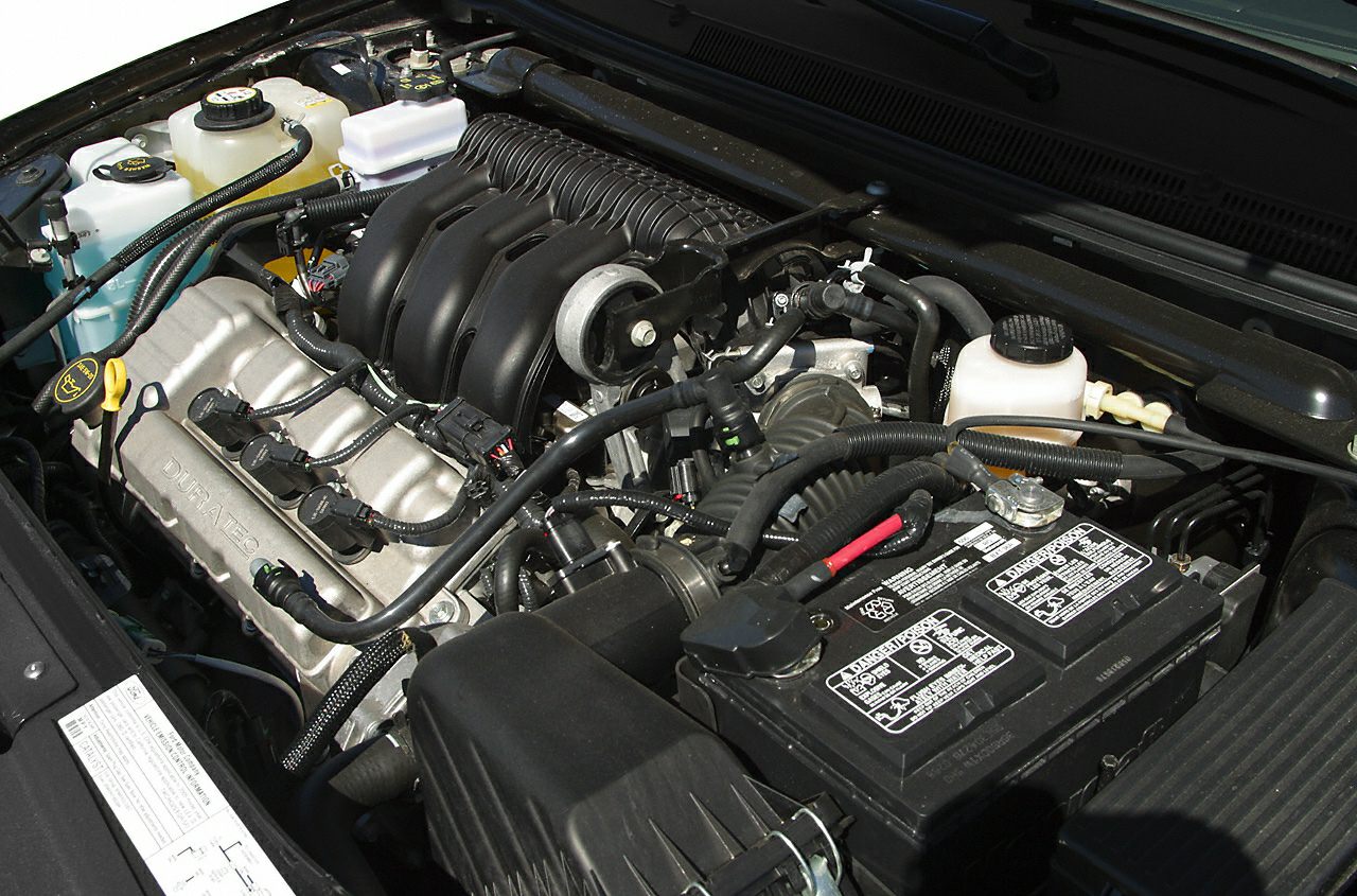 Duratec V6 engine with battery and fluid reservoirs