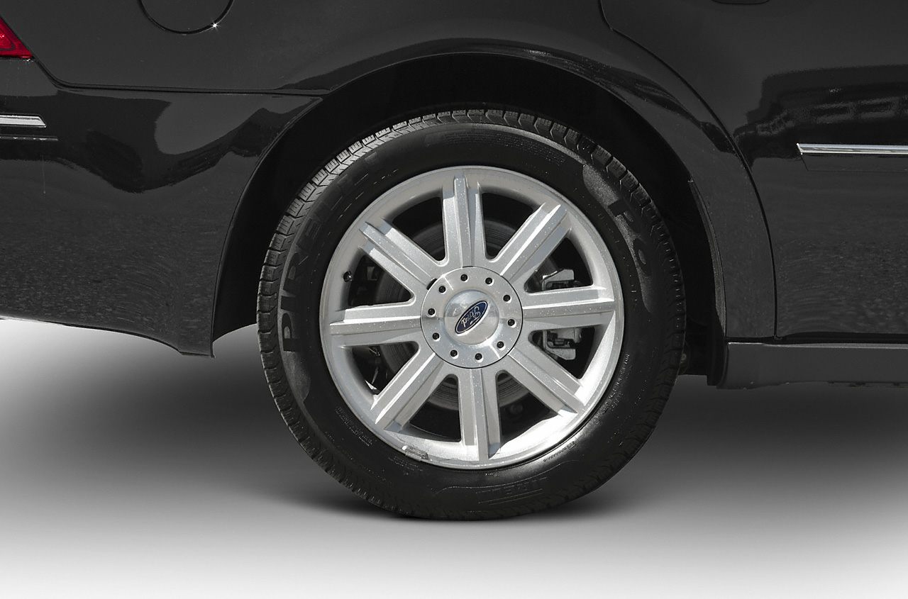 Close-up of alloy wheel and tire on black vehicle