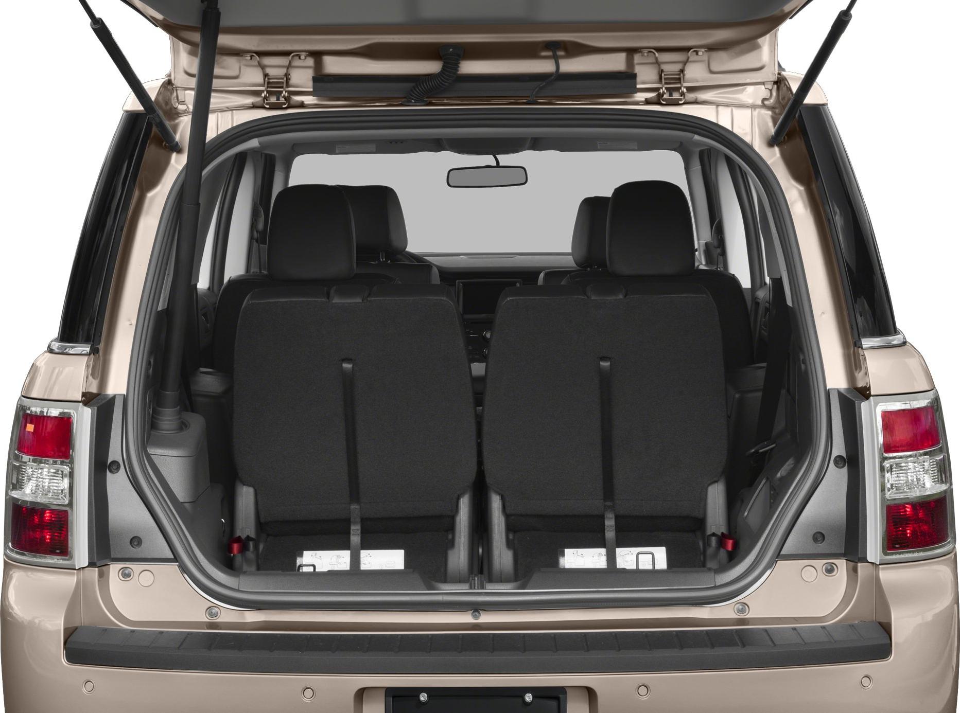 Rear cargo area with folded rear seats and open hatch