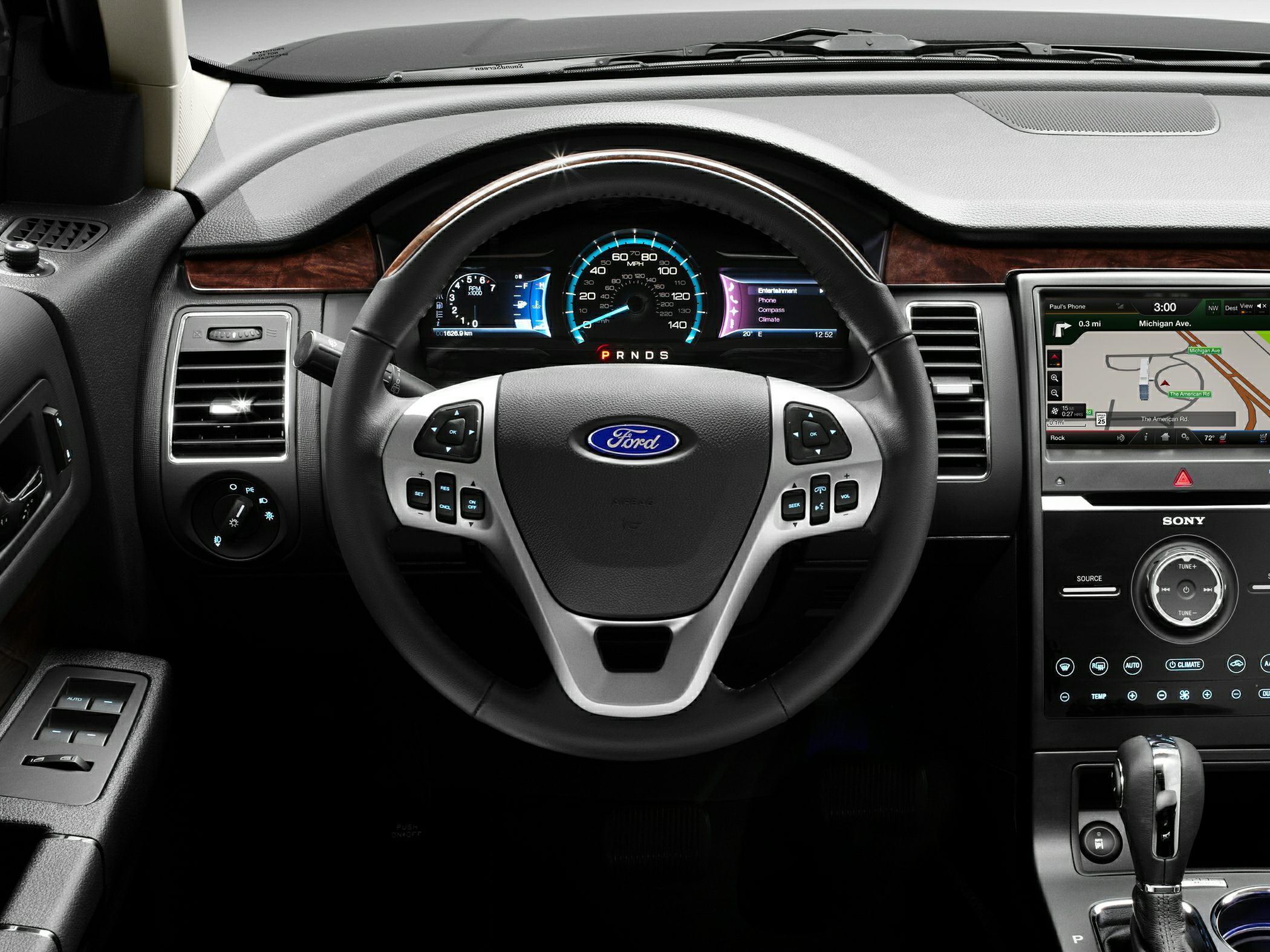 Steering wheel with controls and digital instrument cluster.