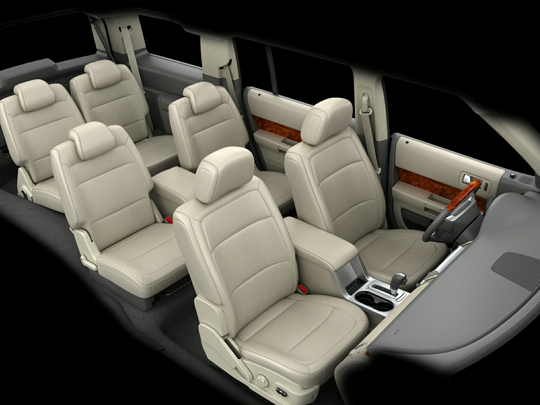 Three rows of beige leather seats with wood trim door panels