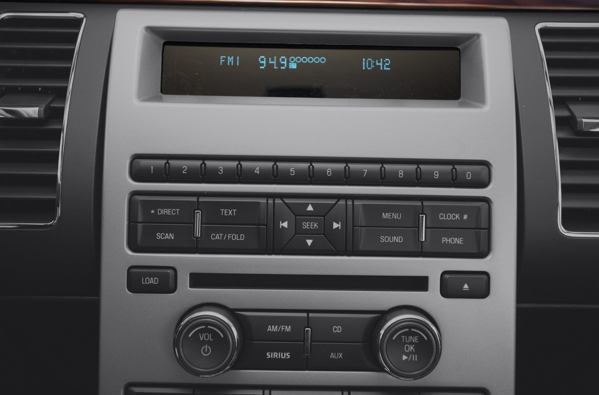 Digital radio control panel with preset buttons and tuning knobs