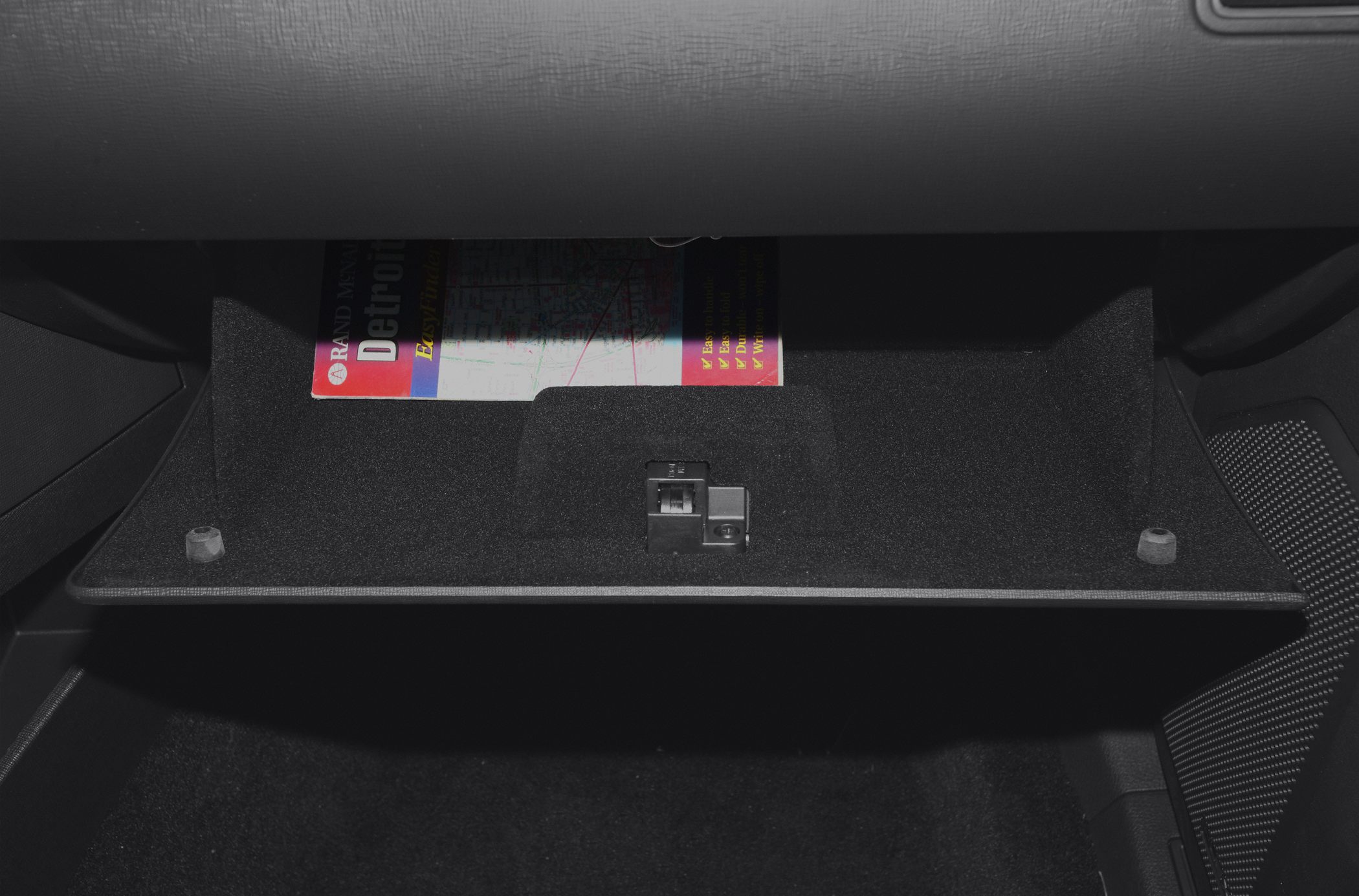 Glove box storage compartment with latch and map inside