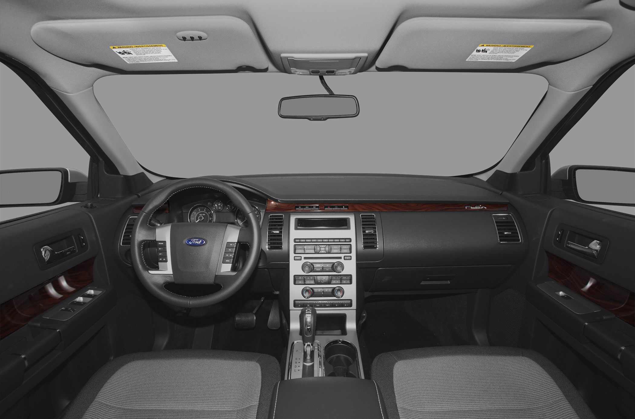 Dashboard and steering wheel with wood trim and control buttons