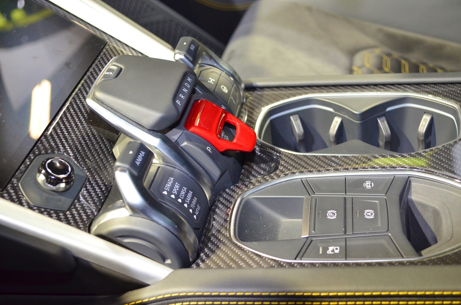 Carbon fiber center console with gear selector and drive mode controls