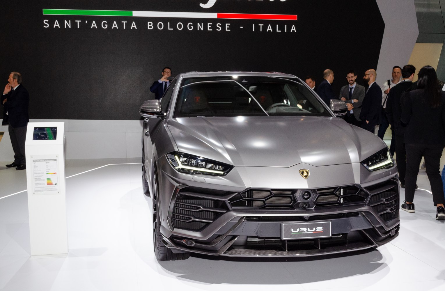 Aggressive LED headlights and sporty front grille of a luxury SUV