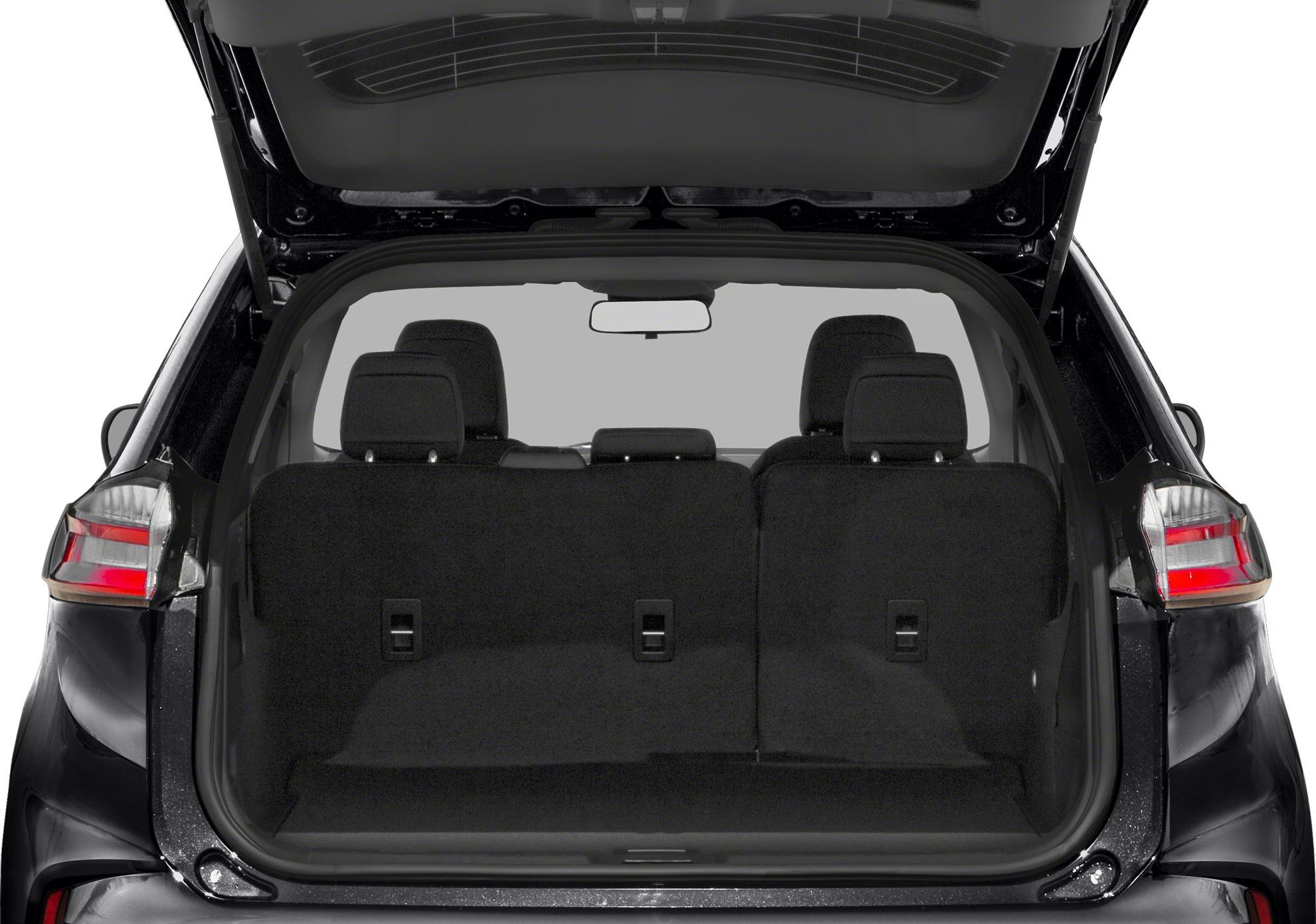 SUV rear cargo space with open tailgate and foldable seats