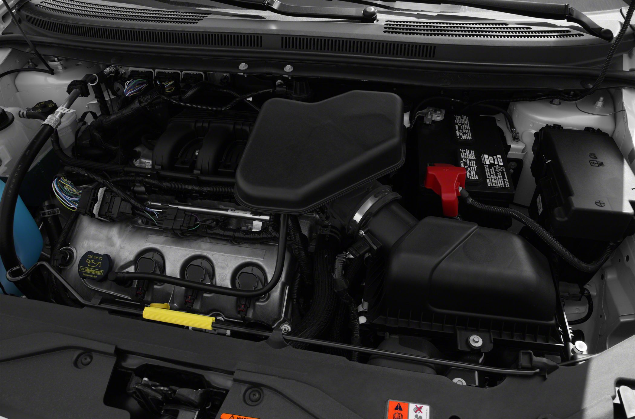 Engine compartment with air filter housing and battery