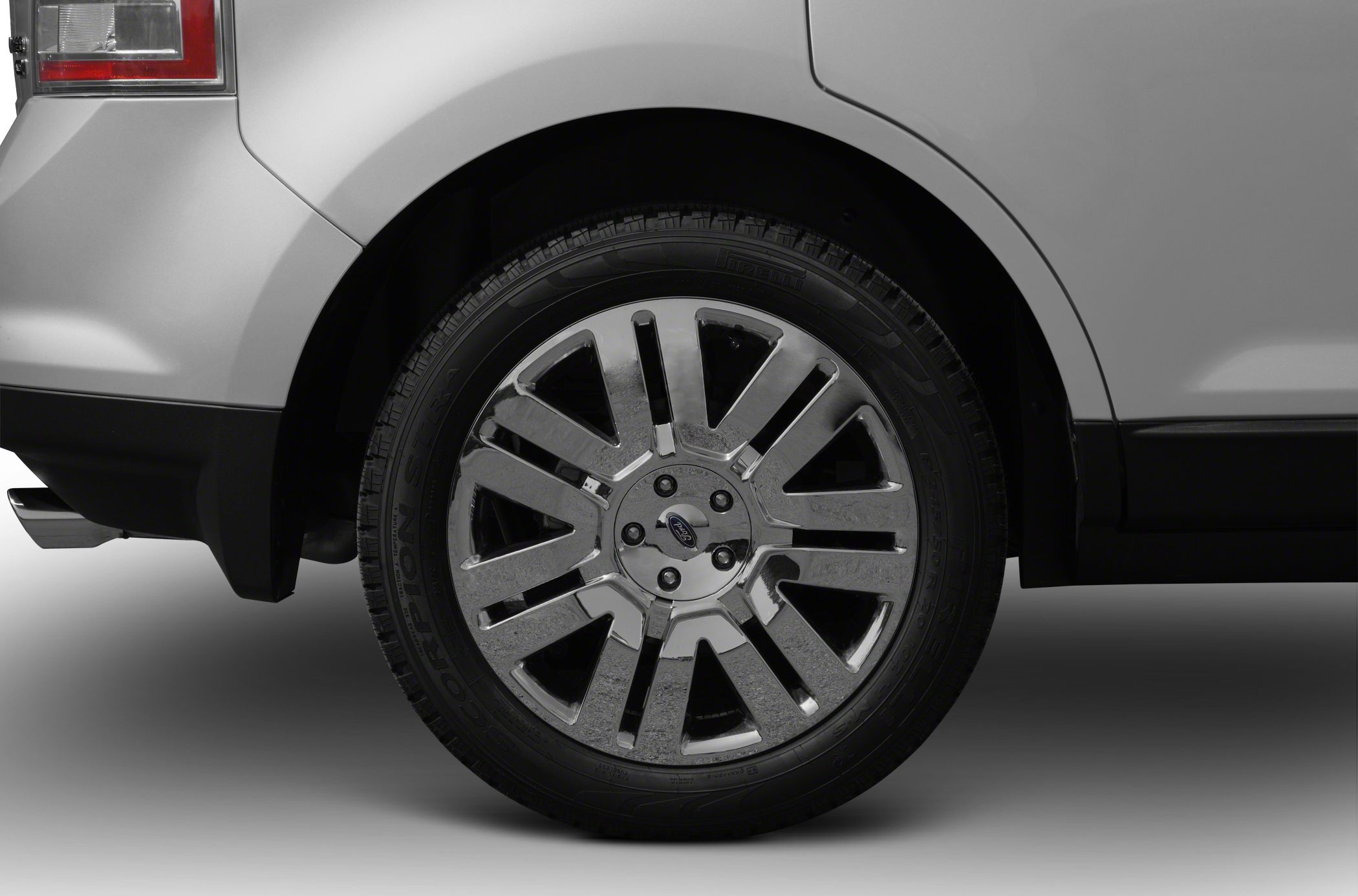 Close-up of a multi-spoke alloy rim with Pirelli Scorpion tire on a vehicle rear wheel