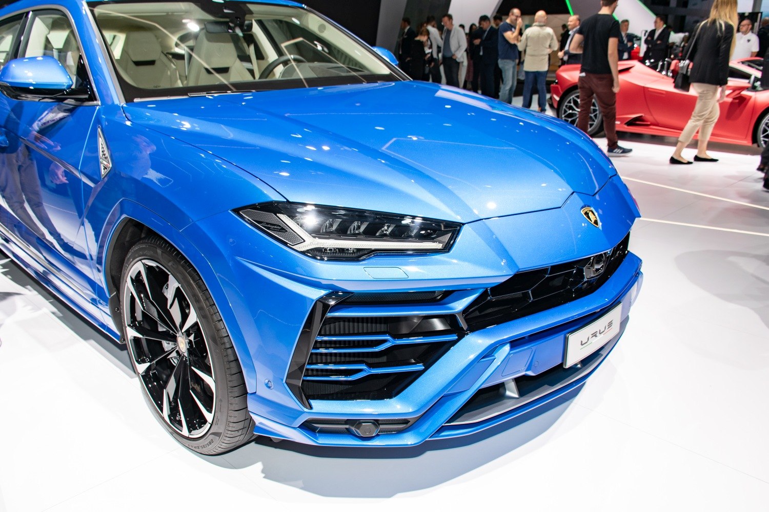 Front view and alloy wheel of a luxury blue SUV