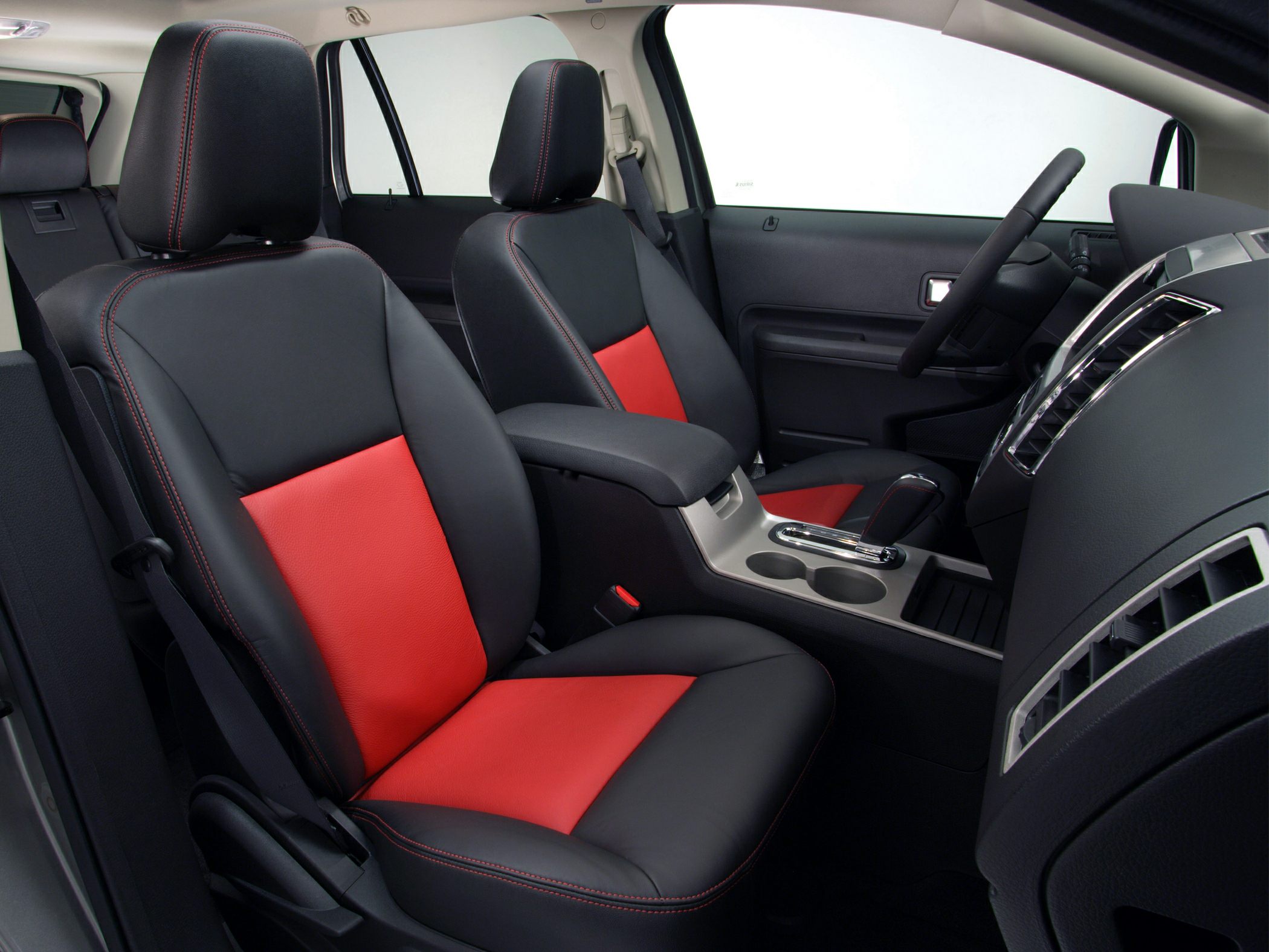 Two-tone leather front seats and center console with gear shift and cup holders