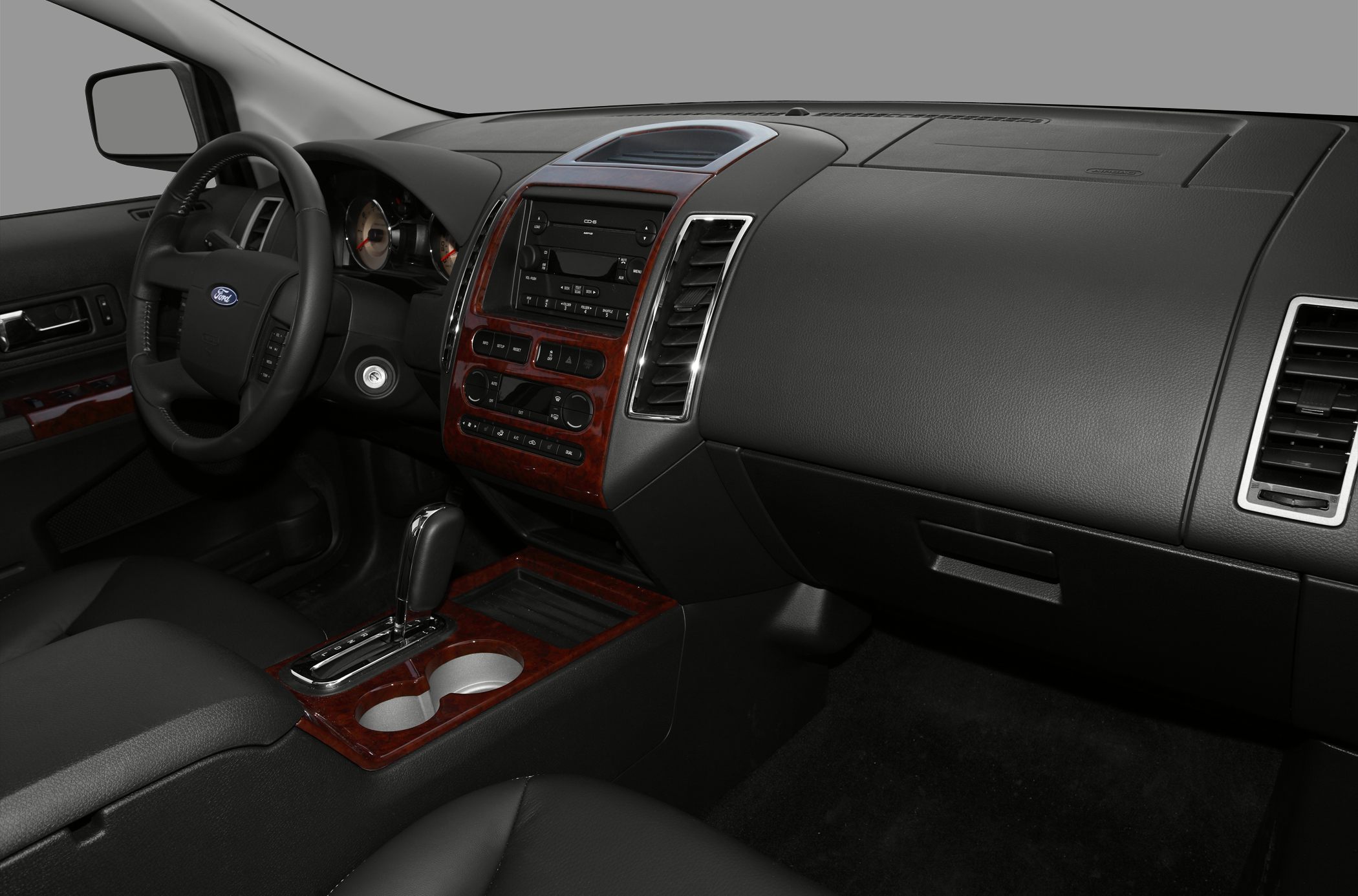 Wood trim accents and automatic gear shift in SUV interior