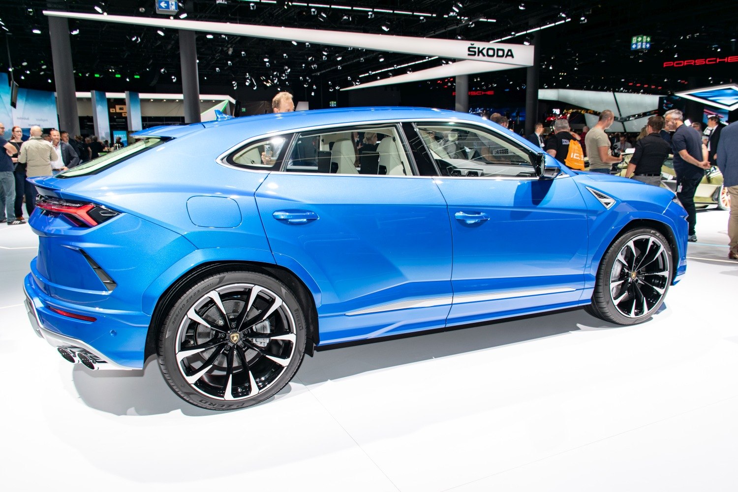 Sleek luxury SUV side profile with distinctive alloy wheels and sporty rear design