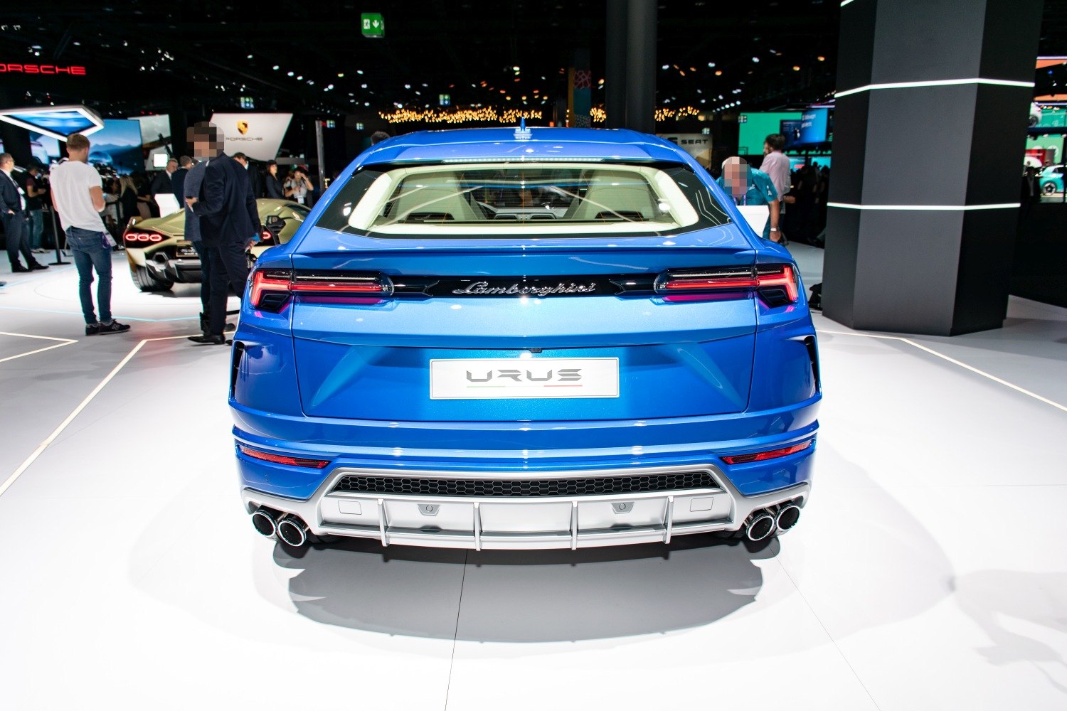 Blue SUV rear view with quad exhaust and horizontal taillights