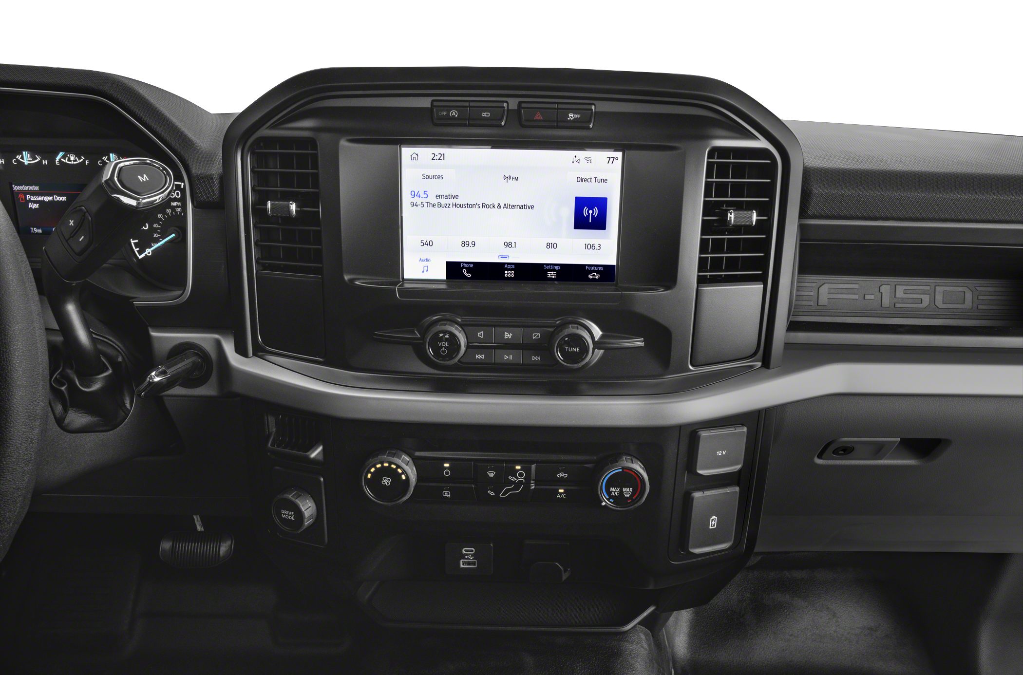Modern truck dashboard with infotainment screen and climate control knobs