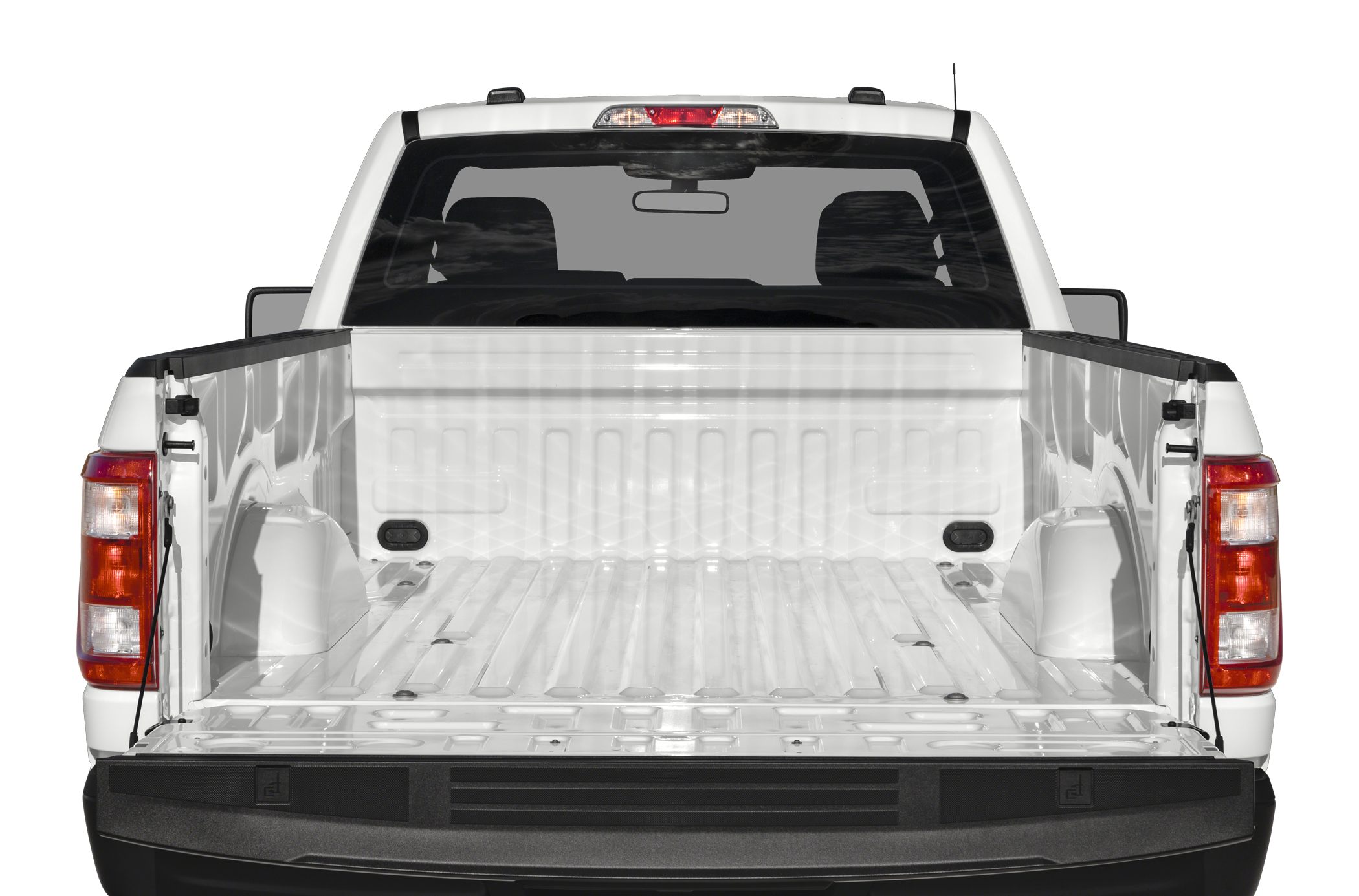 Open long pickup bed with visible tailgate and rear cab window