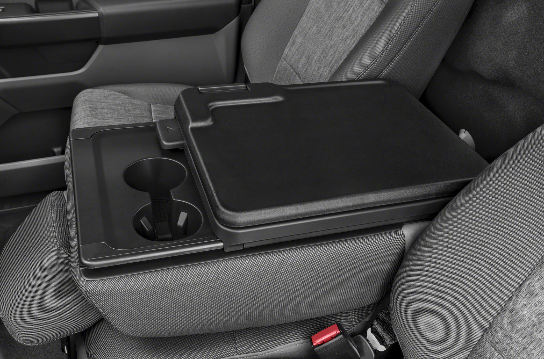 Fold-down center console with integrated cup holders on truck seat