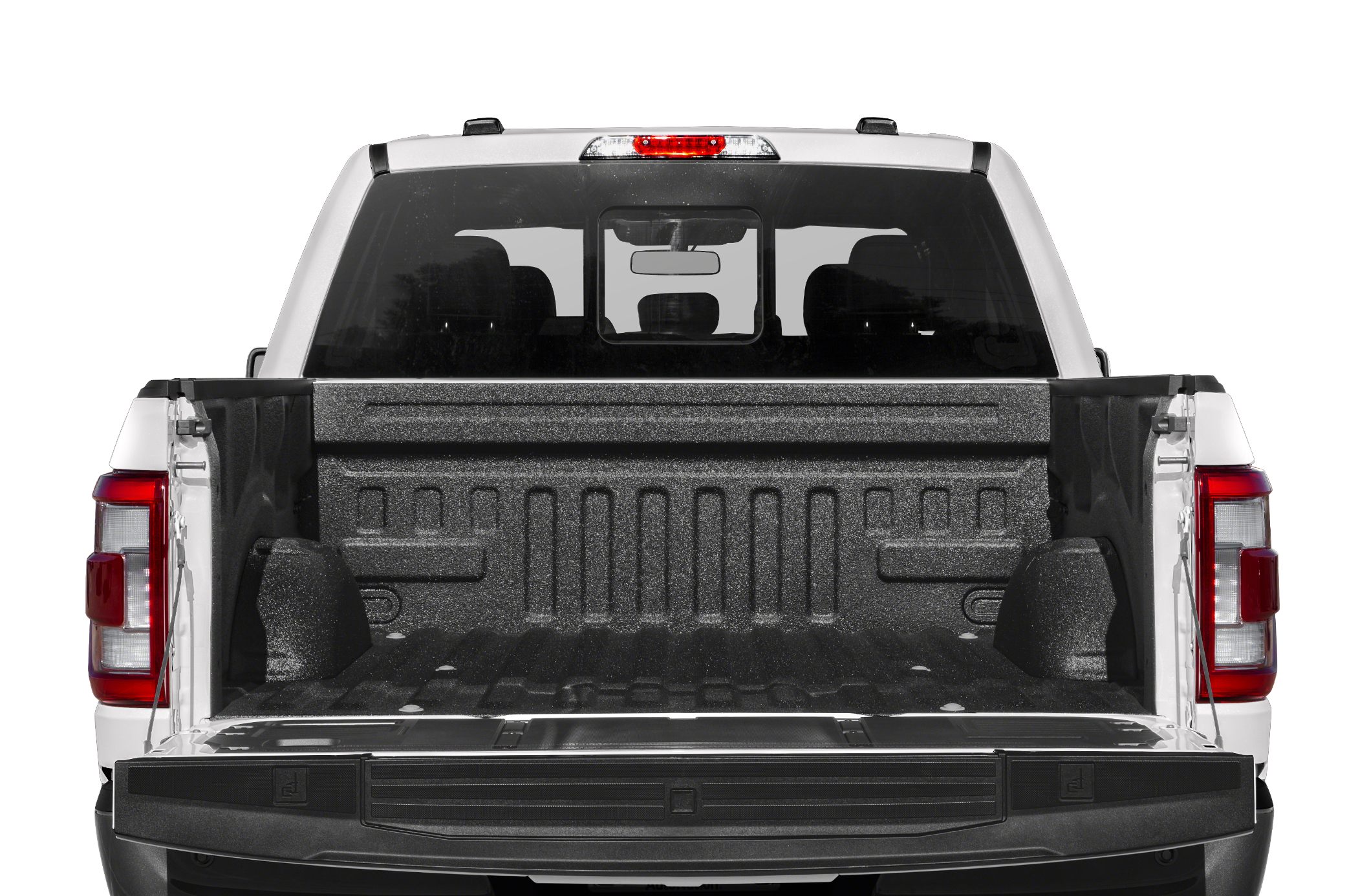 Open pickup bed with textured bed liner and tailgate.