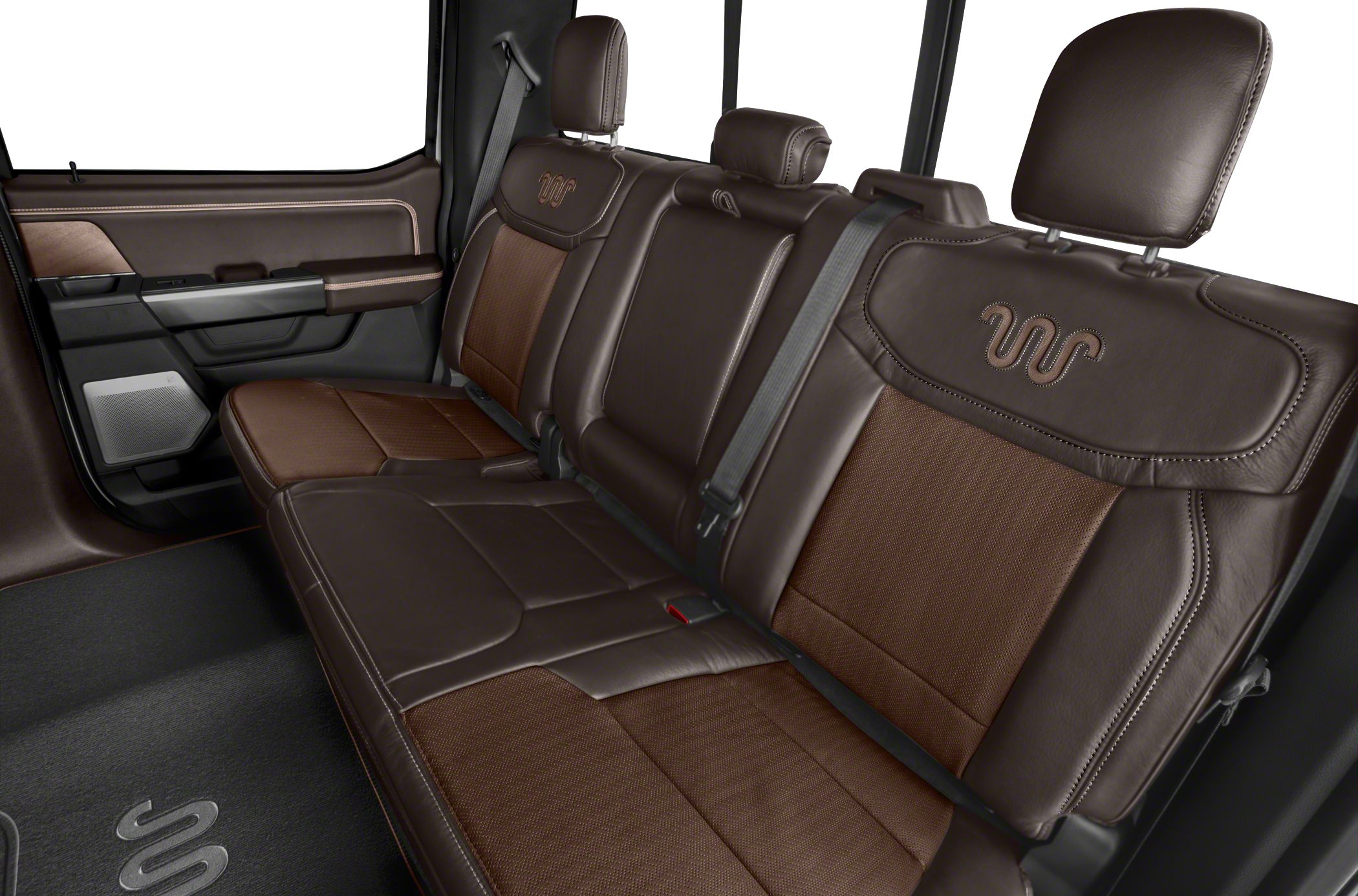 Premium brown leather rear seating with detailed stitching and seat belts