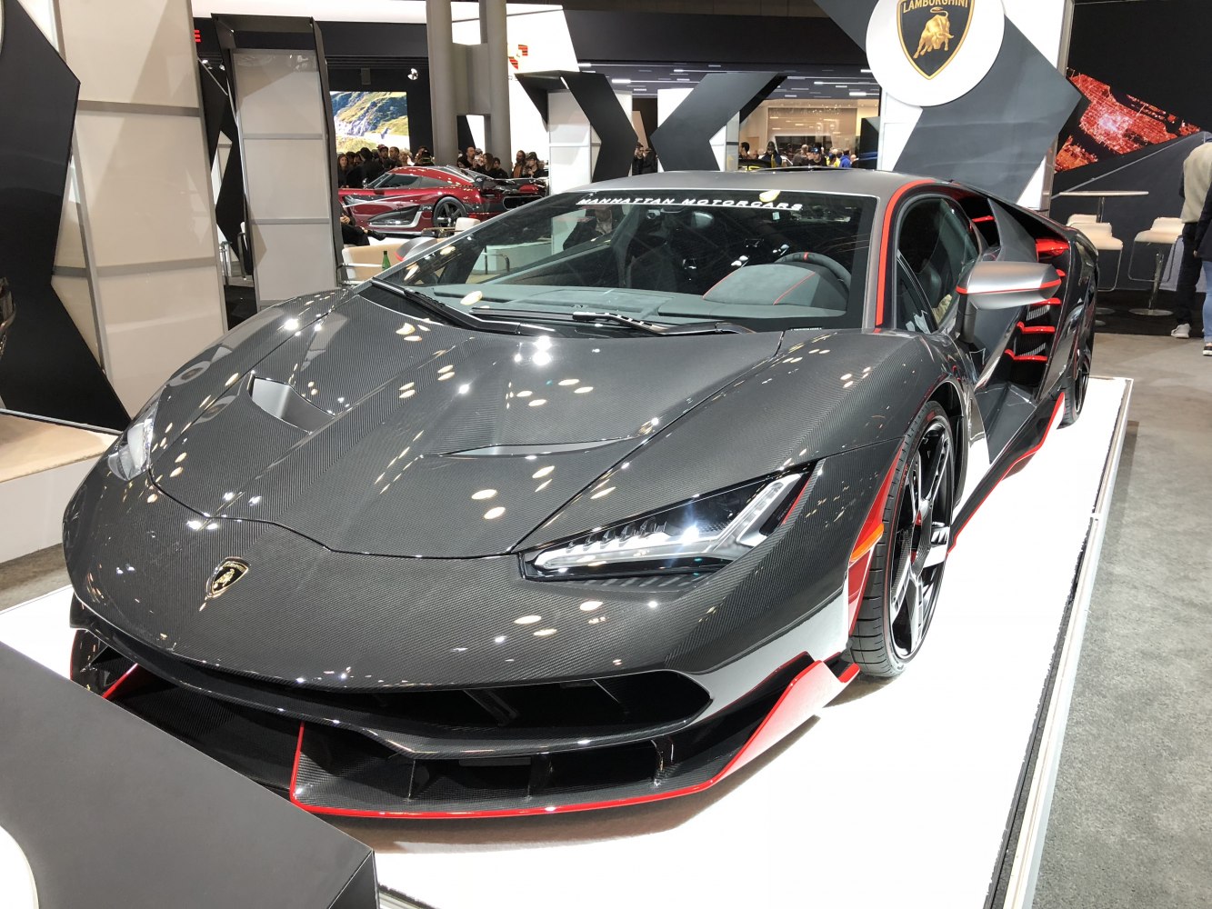 Carbon fiber hood and aerodynamic front design with sharp headlights