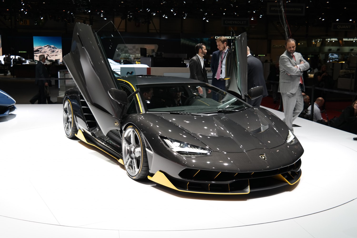 Scissor doors and carbon fiber body with yellow accents