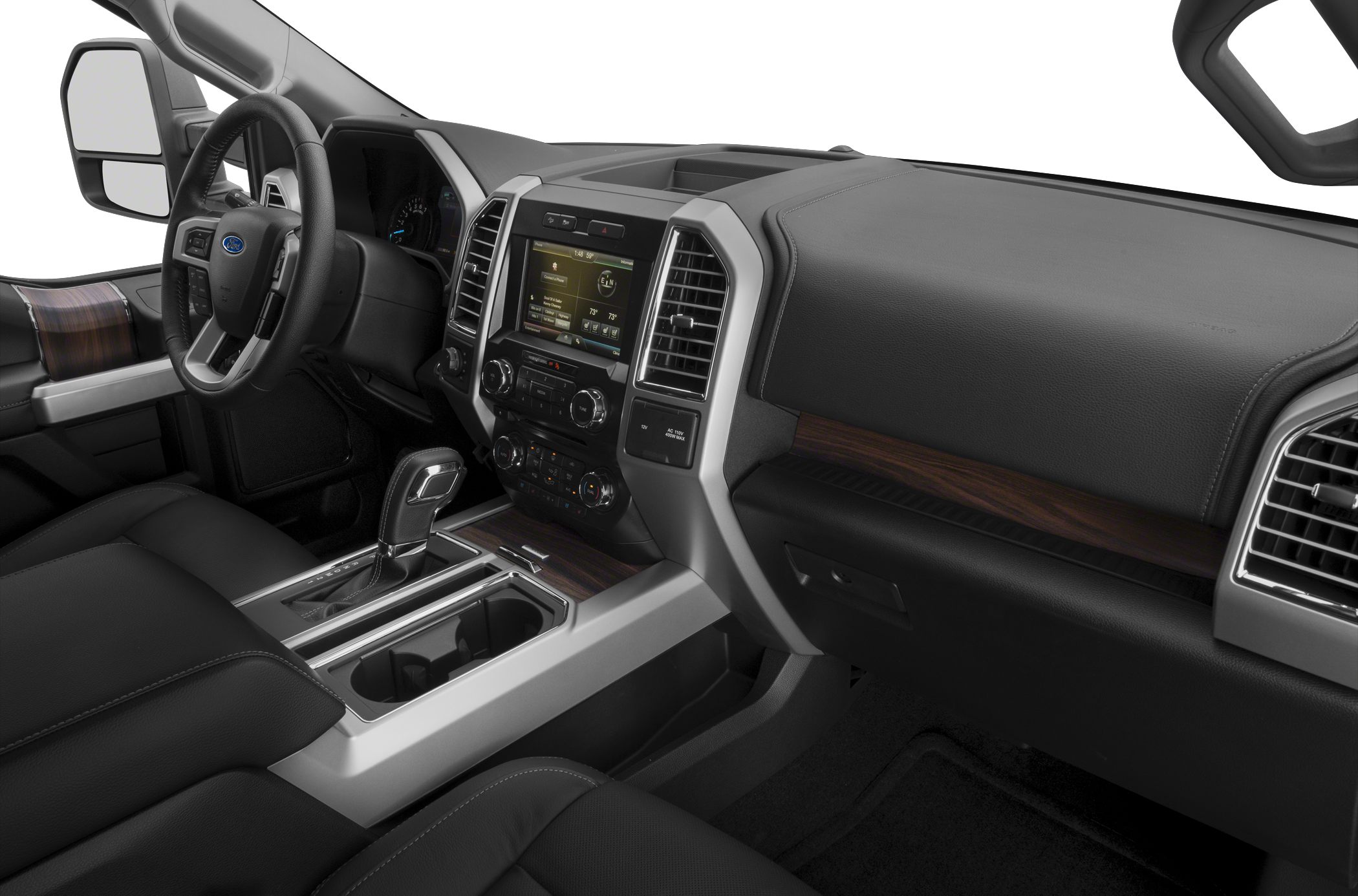 Modern truck interior with touchscreen, steering wheel controls, and premium seating