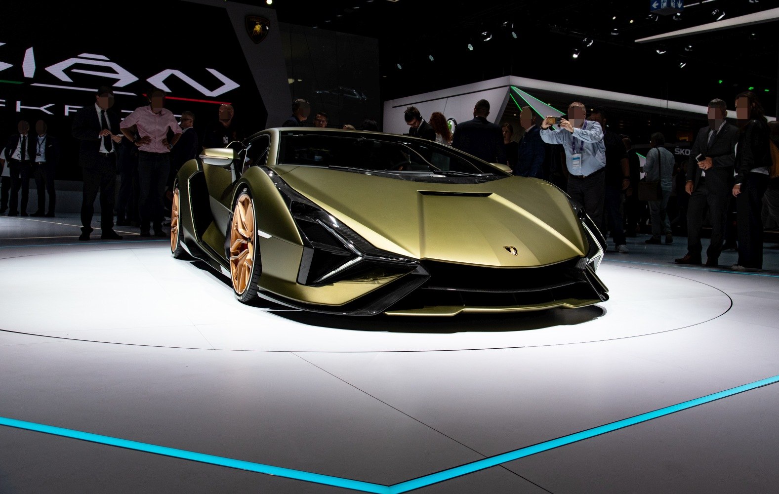 Sharp angular front view with golden alloy wheels