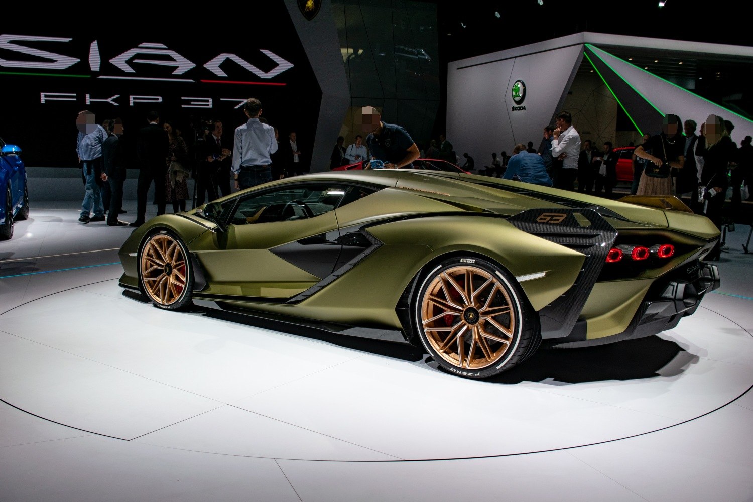 Rear side view of supercar with bronze alloy rims and angular, aerodynamic design
