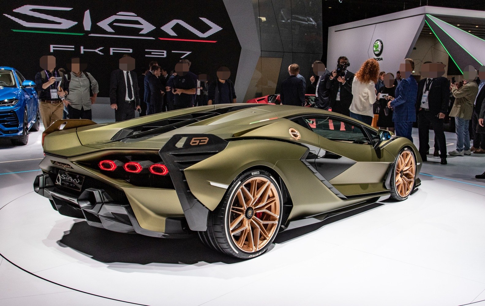 Rear and side of a hybrid supercar with hexagonal tail lights and aerodynamic features