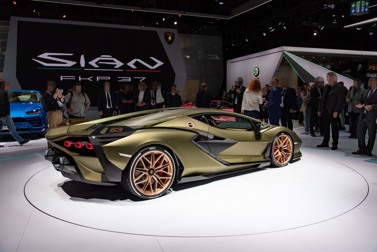 Aerodynamic rear side view with distinctive taillights and gold alloy wheels