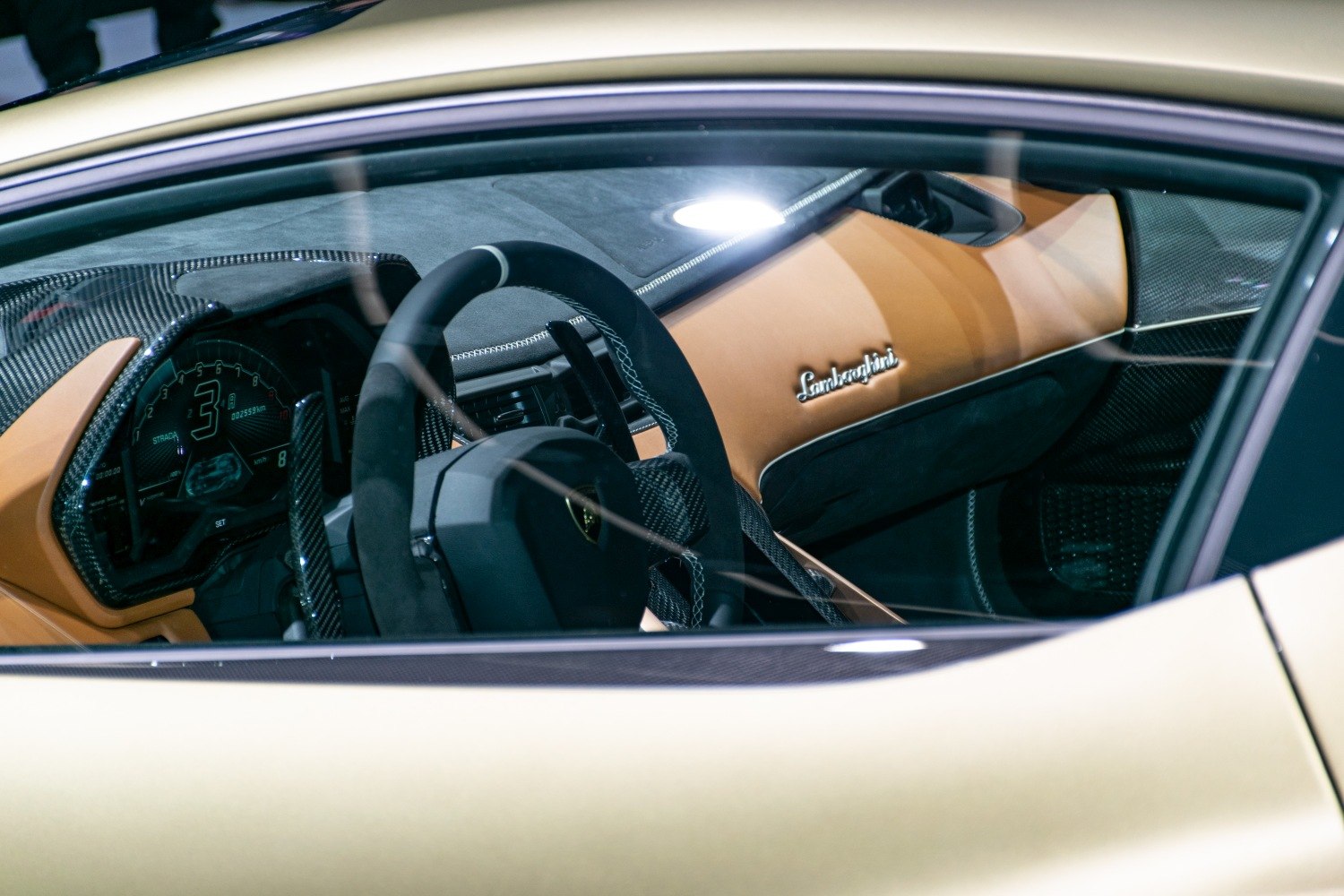 Carbon fiber dashboard and digital instrument cluster in luxury sports car interior