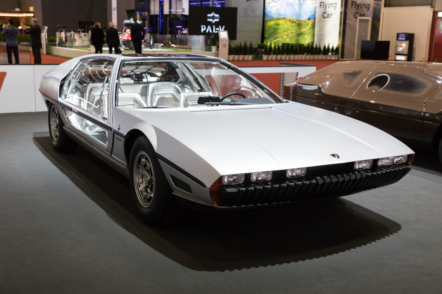 Futuristic 1967 sports vehicle with glass body and distinctive front lights
