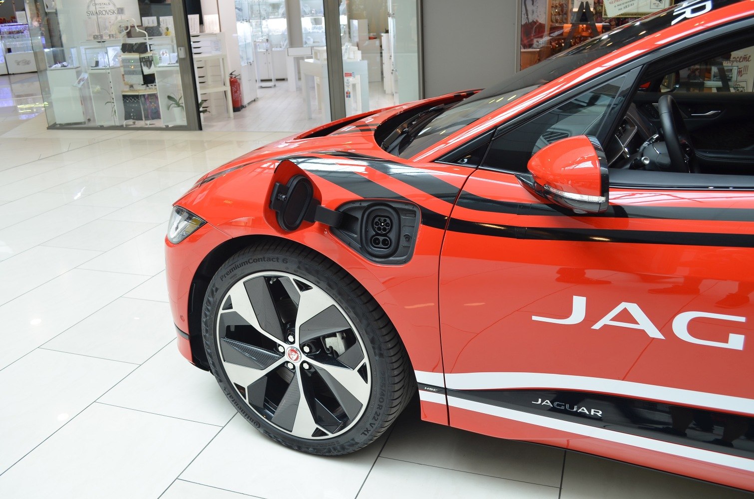 Electric charging port and distinctive front wheel design