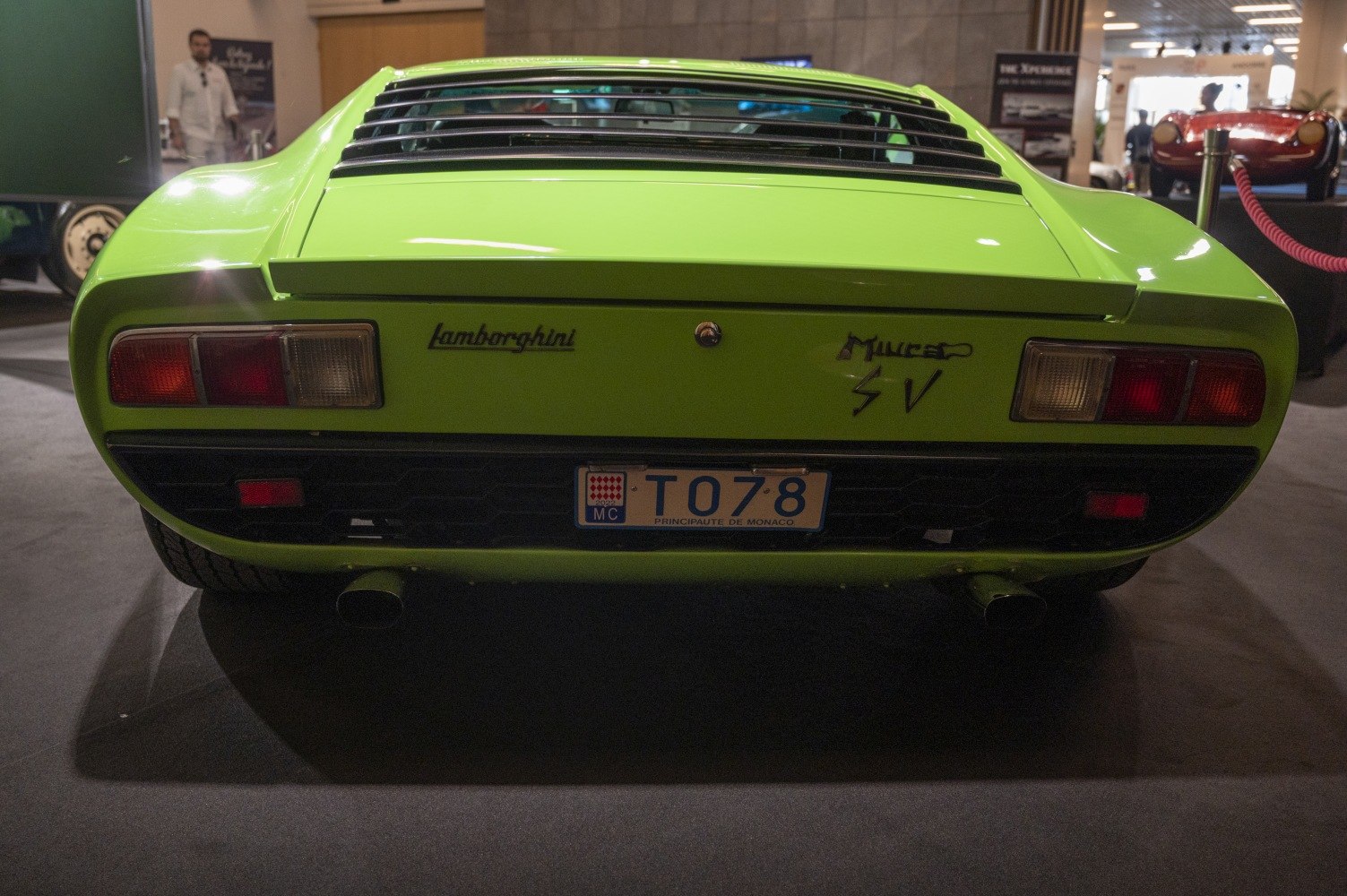 Rear view of vintage sports car with dual exhausts and taillights