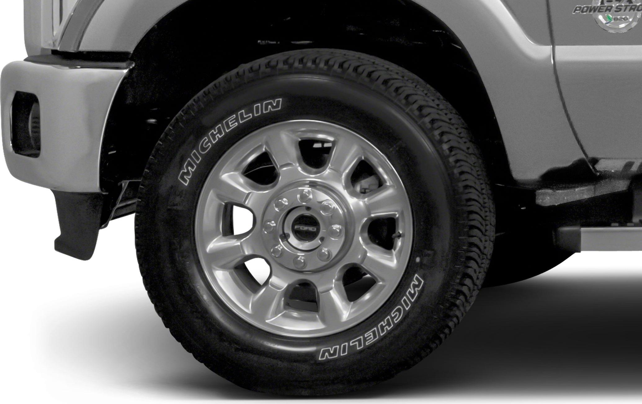 Michelin tire on alloy wheel with visible lug nuts