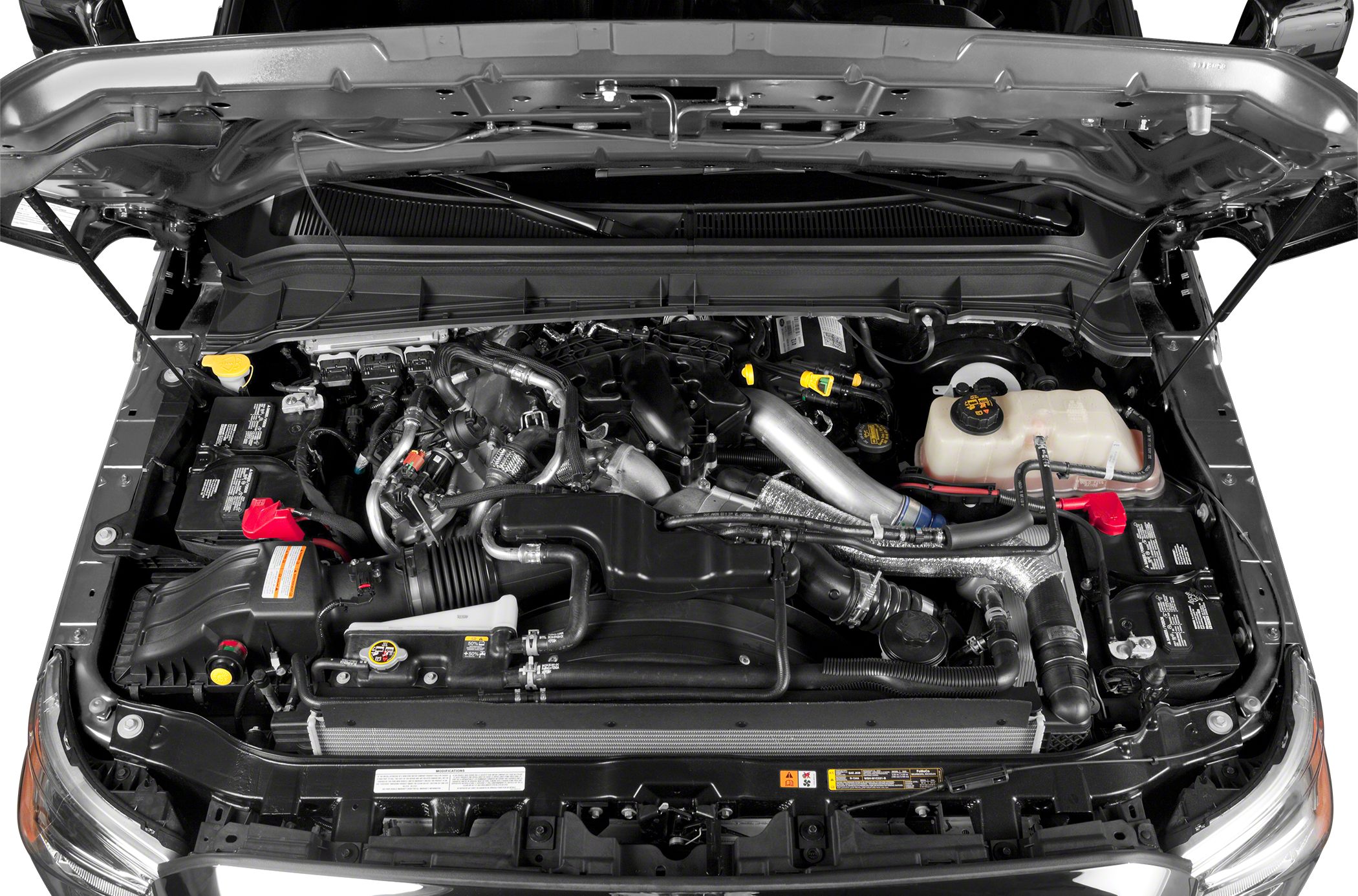 Engine bay with detailed pipes, battery, and fluid reservoirs