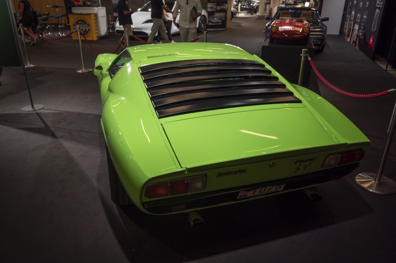 Rear view with louvered engine cover in vibrant green