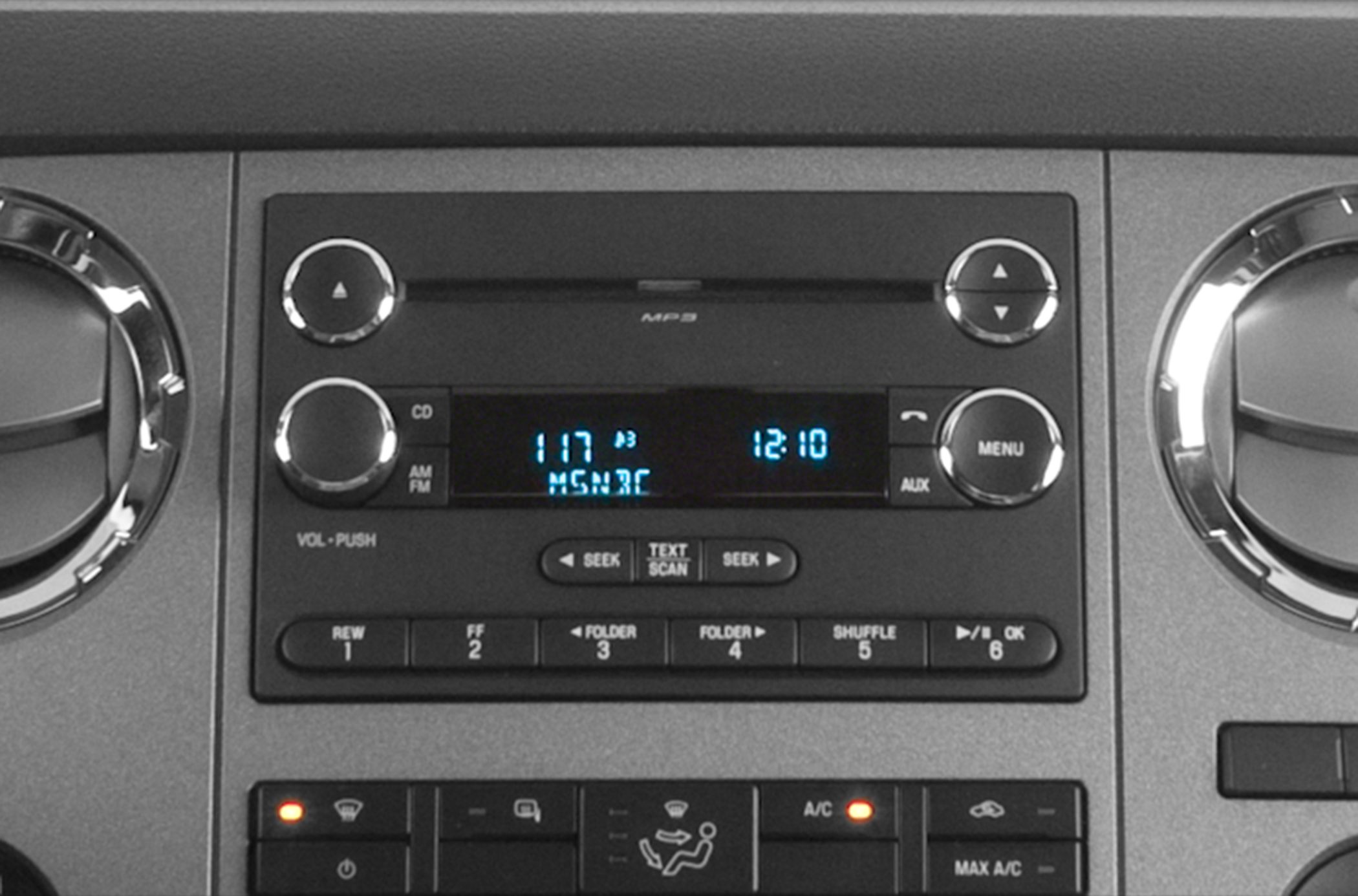 Audio system panel with control buttons and climate control knobs