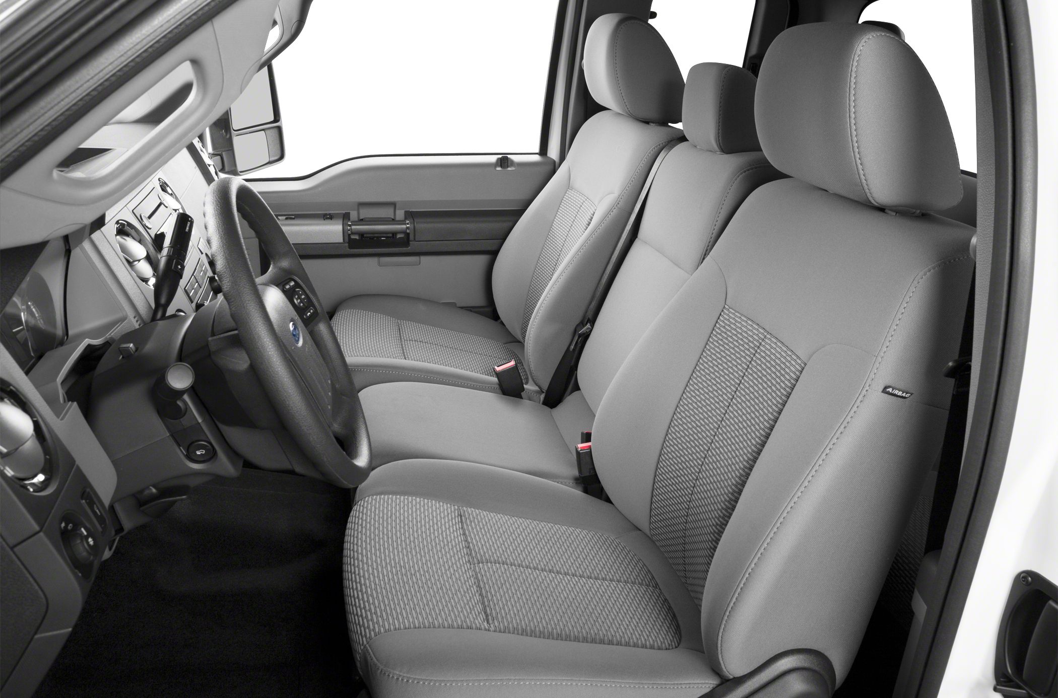 Grey fabric seats and dashboard controls in a truck interior