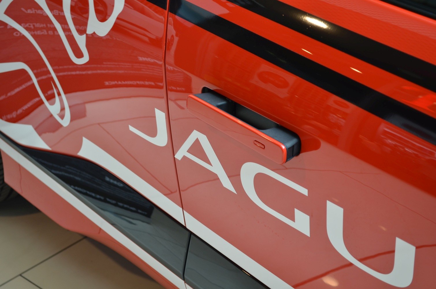 Close-up of electric SUV door handle and side design detailing.