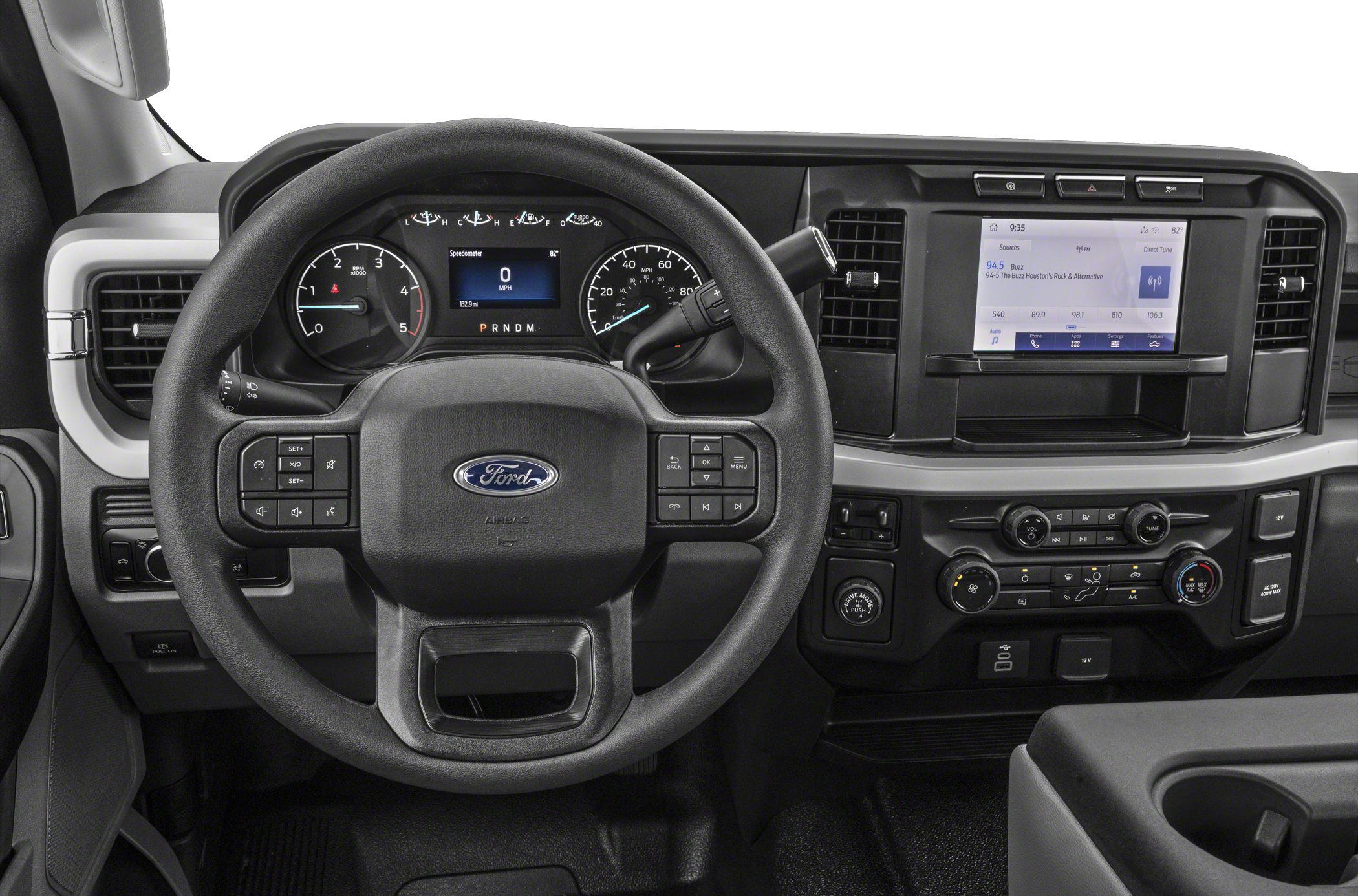 Steering wheel with digital cluster and touchscreen in a truck cabin.