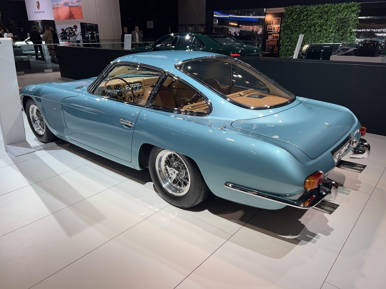 Vintage coupe with sleek rear side, chrome wire wheels and classic design